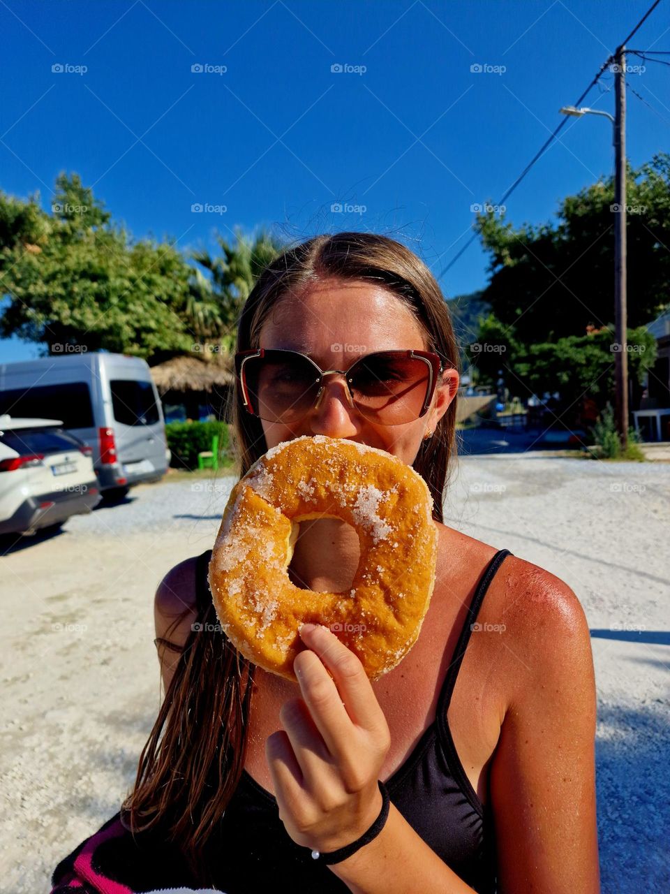 happy that she has a big doughnut