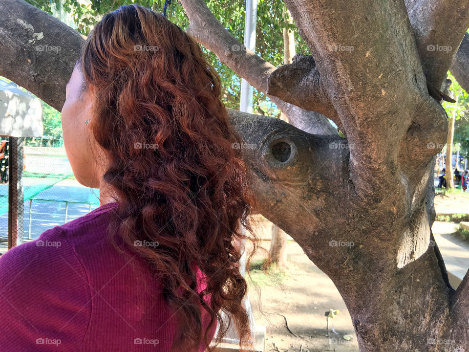 A woman with a curly hair
