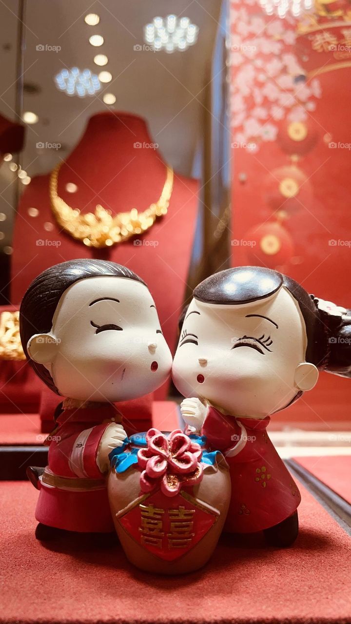 Doll greeting Chinese New Year