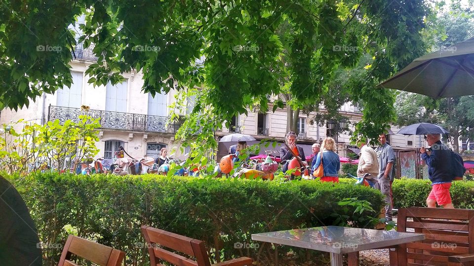 People are gathered in a street market in Montpellier, France