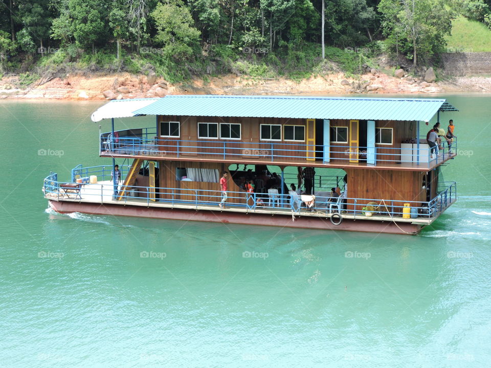 In a beautiful Houseboat. Staying in a Houseboat in a Lake in Asia