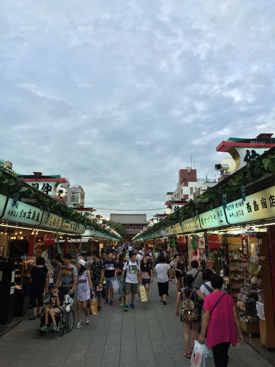 Group of people walking at market