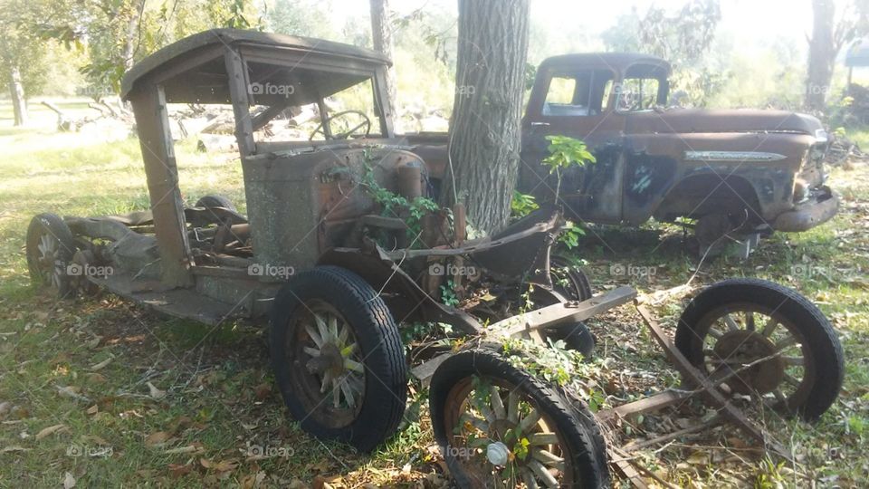 closeup of old antique dilapidated trucks