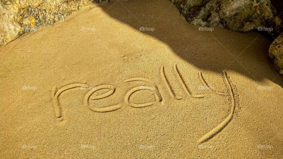 High angle view of text on sand at beach