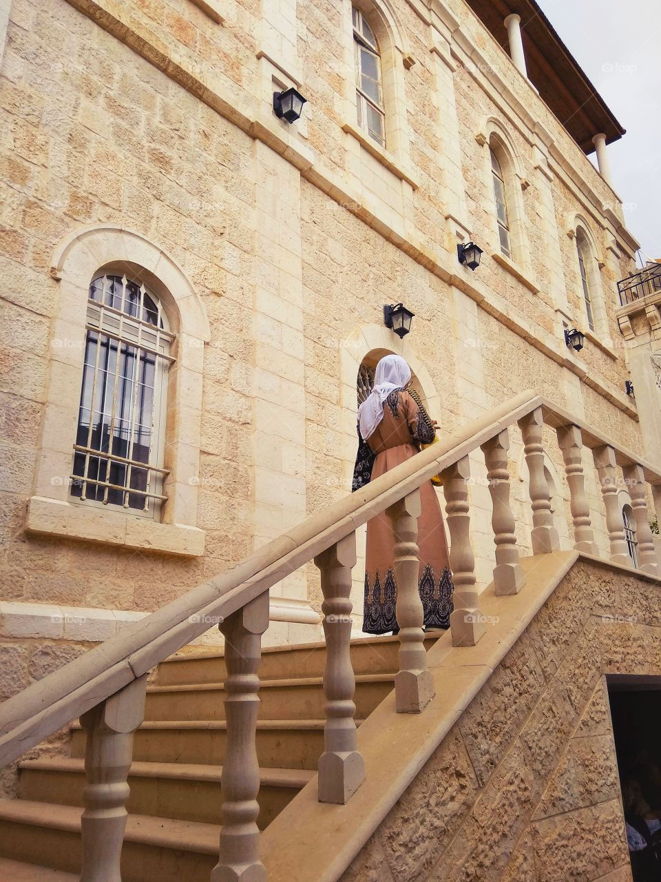 Woman climbing the steps in Jerusalem - I keep wondering, what she's thinking about. 

Jerusalem, Israel