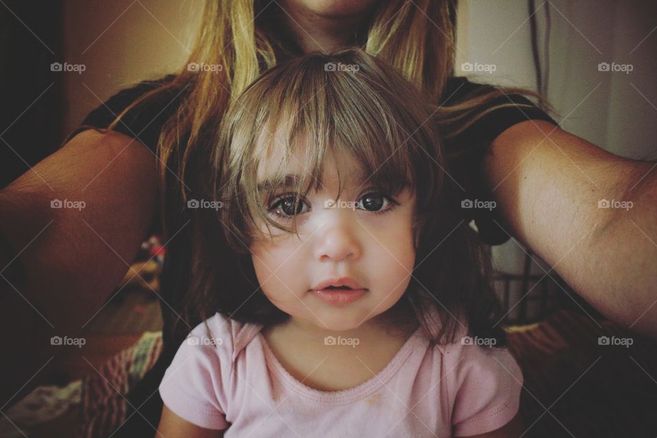 Mother taking selfie with her daughter