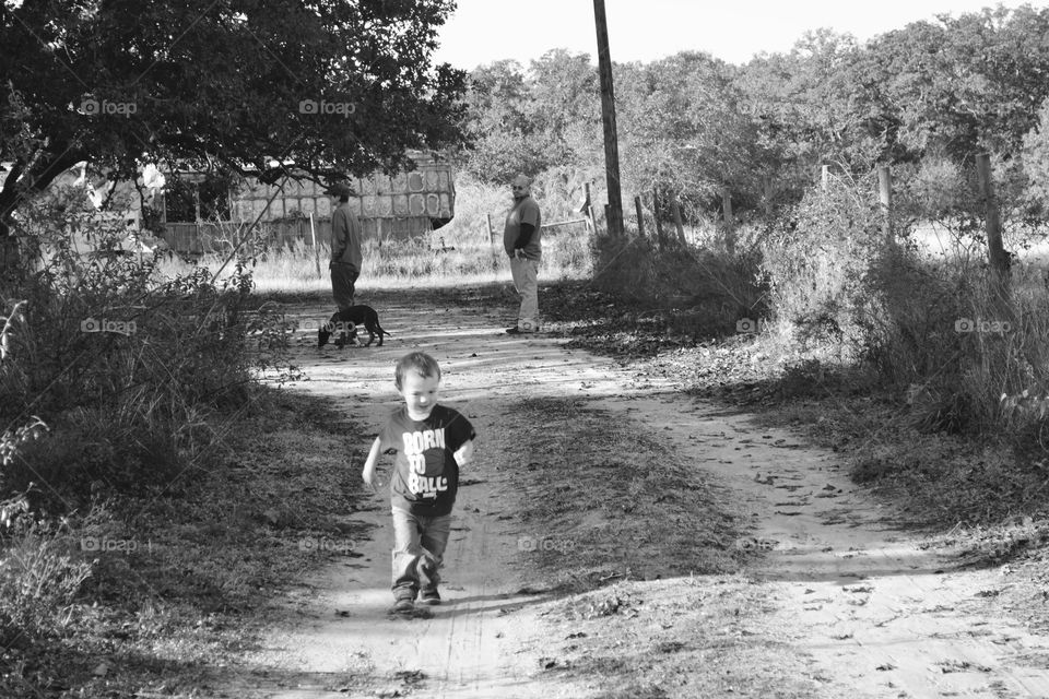 Grandsons favorite place on the farm is running up and down the road in the country.