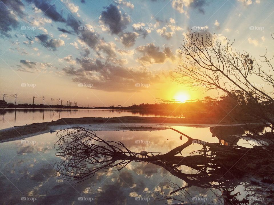 sunset by a lake 