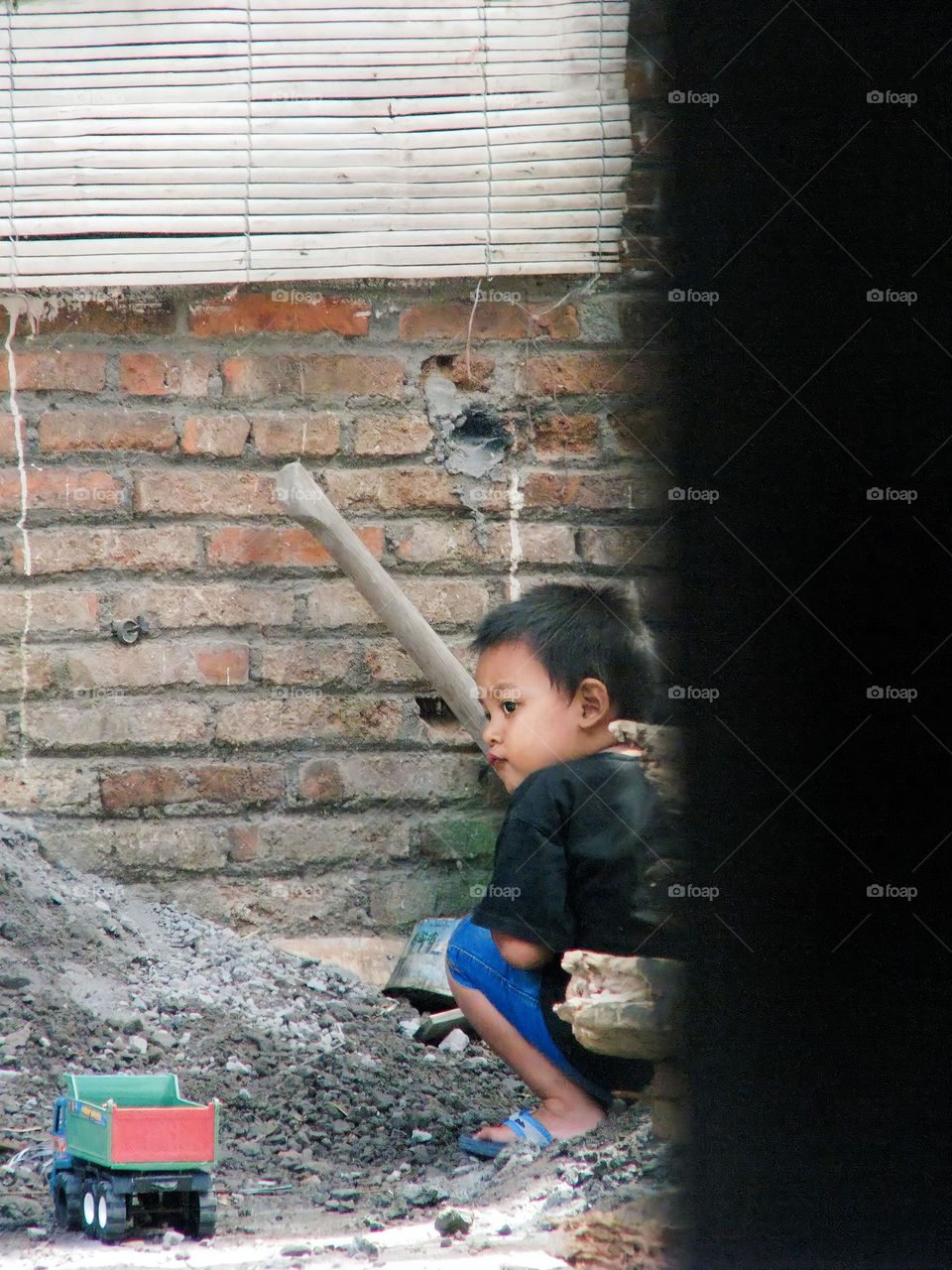 Semarang, Central Java, Indonesia - December 12, 2023: little boy with backpack in the park