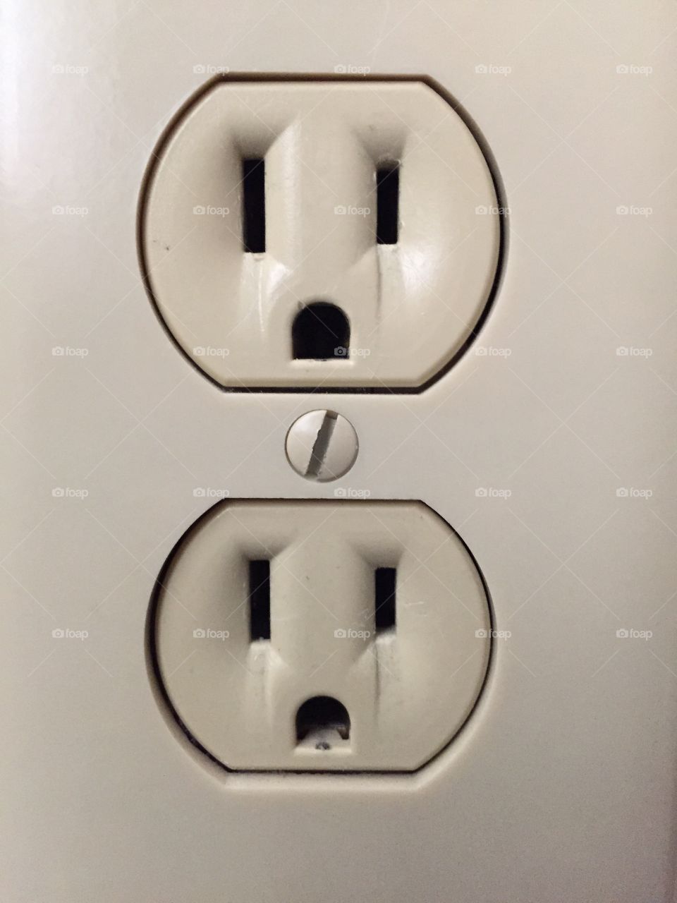 Plug. A 2 socket tan plug.