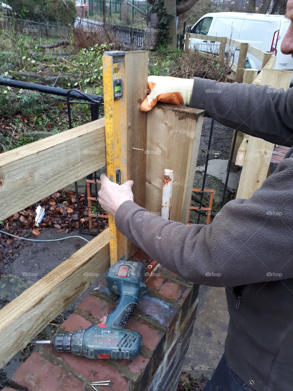 measuring with spirit level on fencing