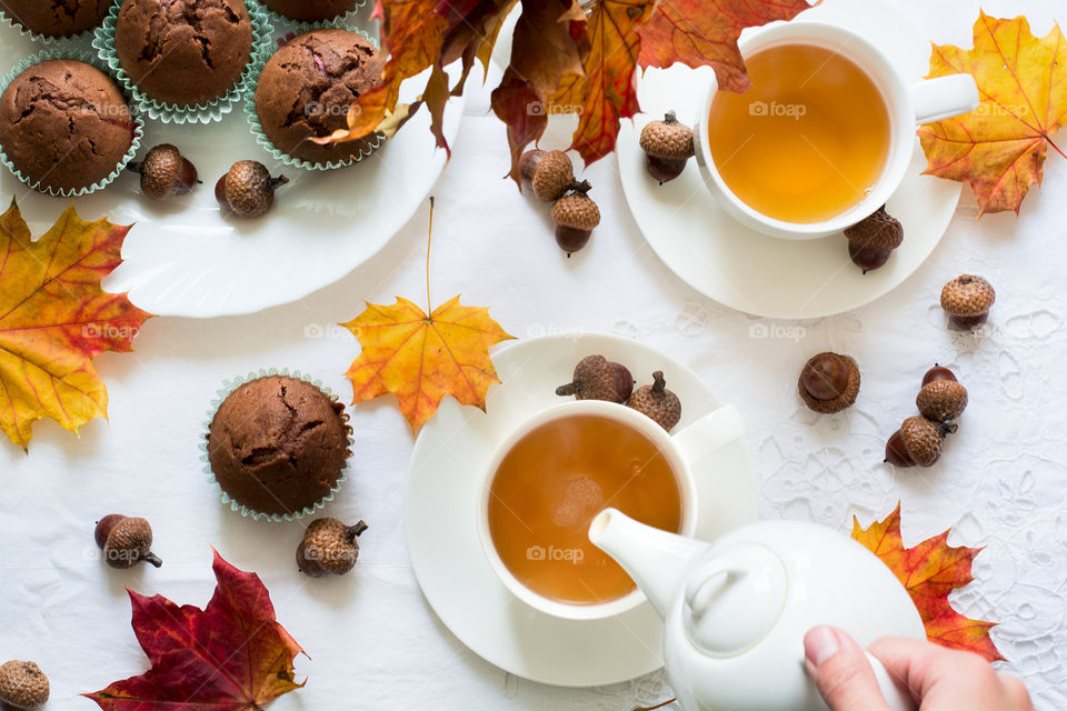 Pouring milk in tea