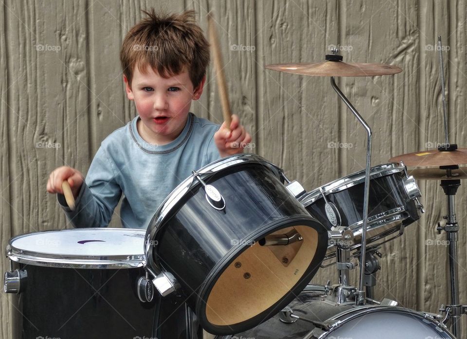 Little Boy Playing Drums
