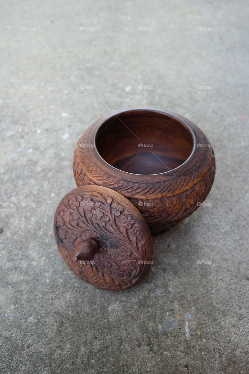 traditional ornamental pot, its dark inside revealed without lid