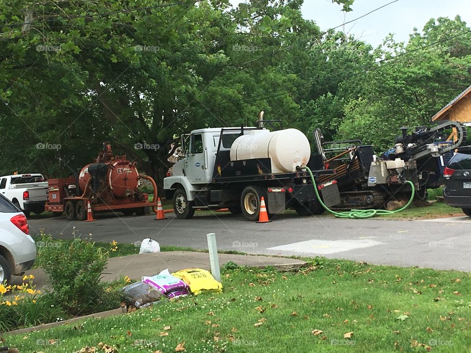 Running fiber optic lines under ground they halve half of our road blocked. Interesting to watch.