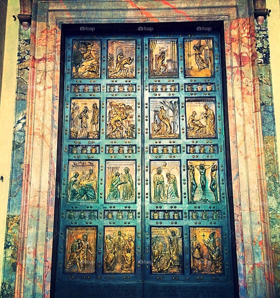 Saint Peters Basilica front doors with multiple engravings