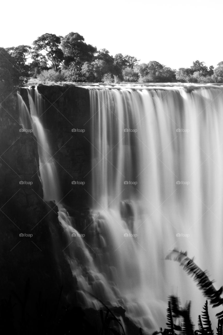 2019 a year of beautiful black and white images. Photo of waterfall with slow shutter showing the majestic water. Image from Africa.