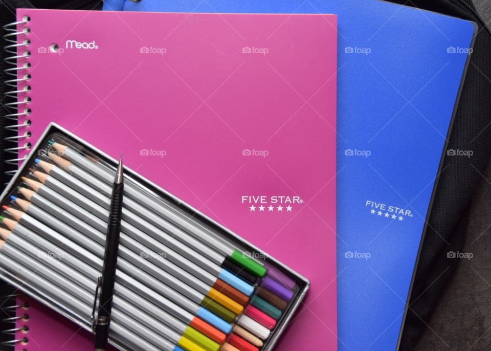 Five star notebooks and binders in blue and magenta