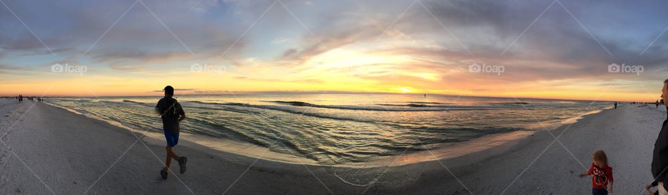 Panoramic view of the sunset on the beach 