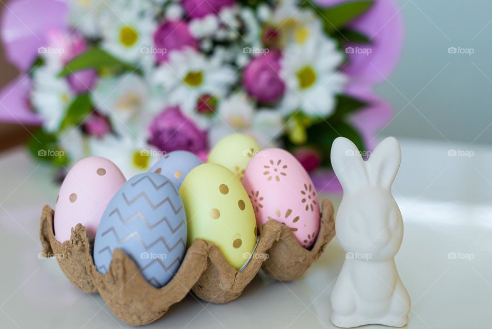 Easter traditionally colored eggs and rabbit 