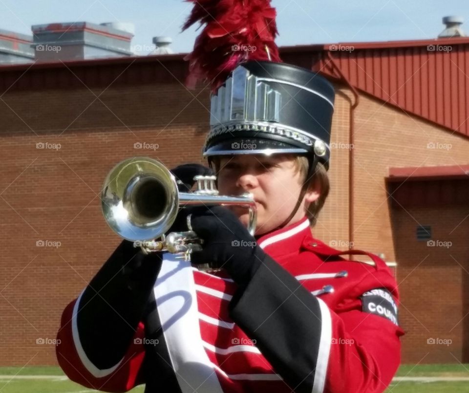 Portrait of a man playing trumpet