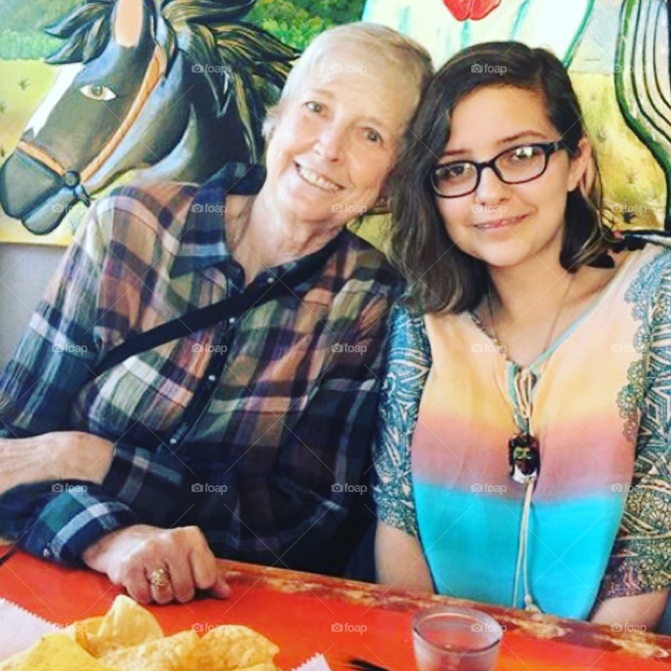 Grandma and granddaughter at mexican restaurant