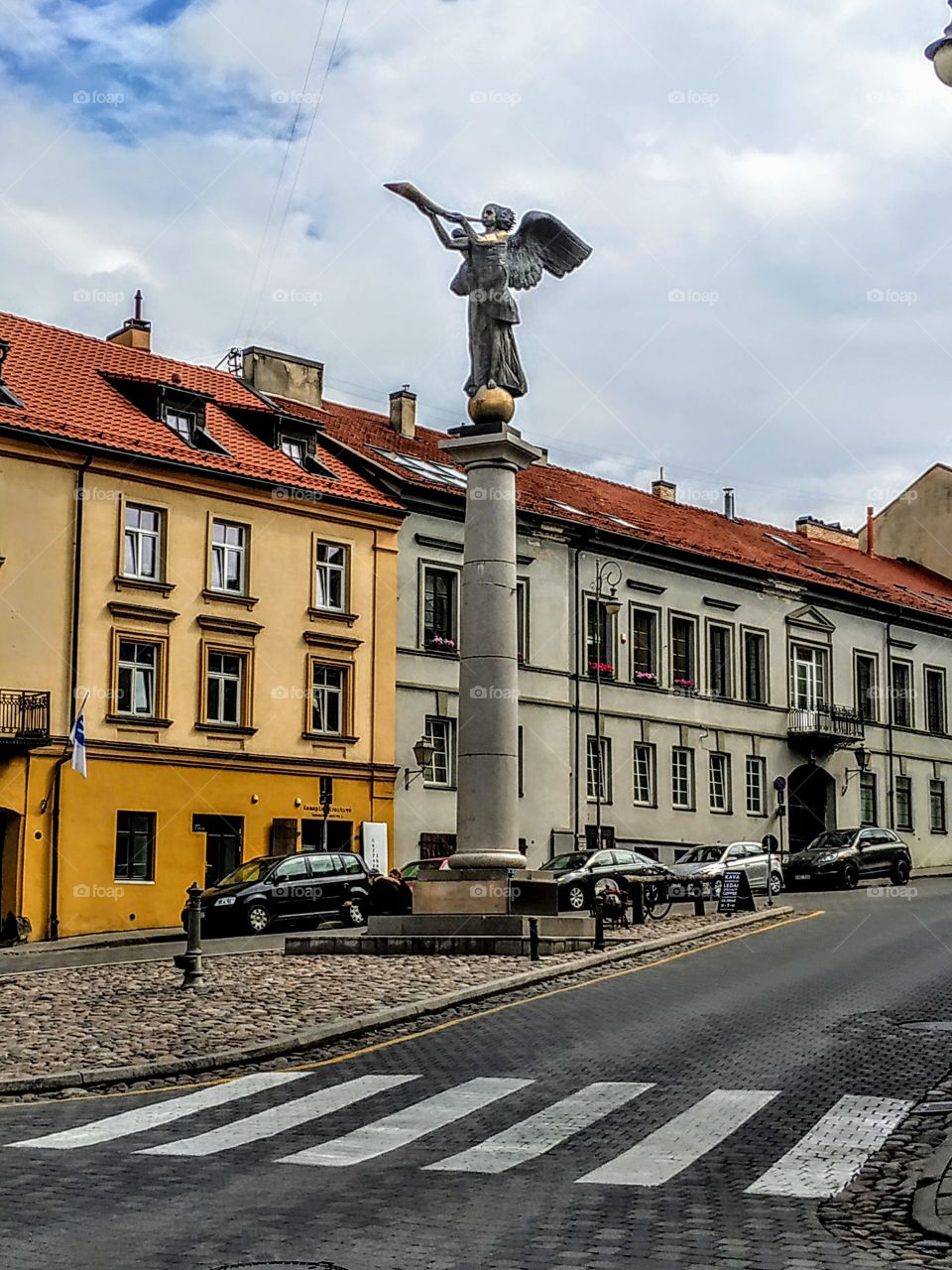 Angel in the center of the square. (Lithuania, Vilnius, July, 2019).
