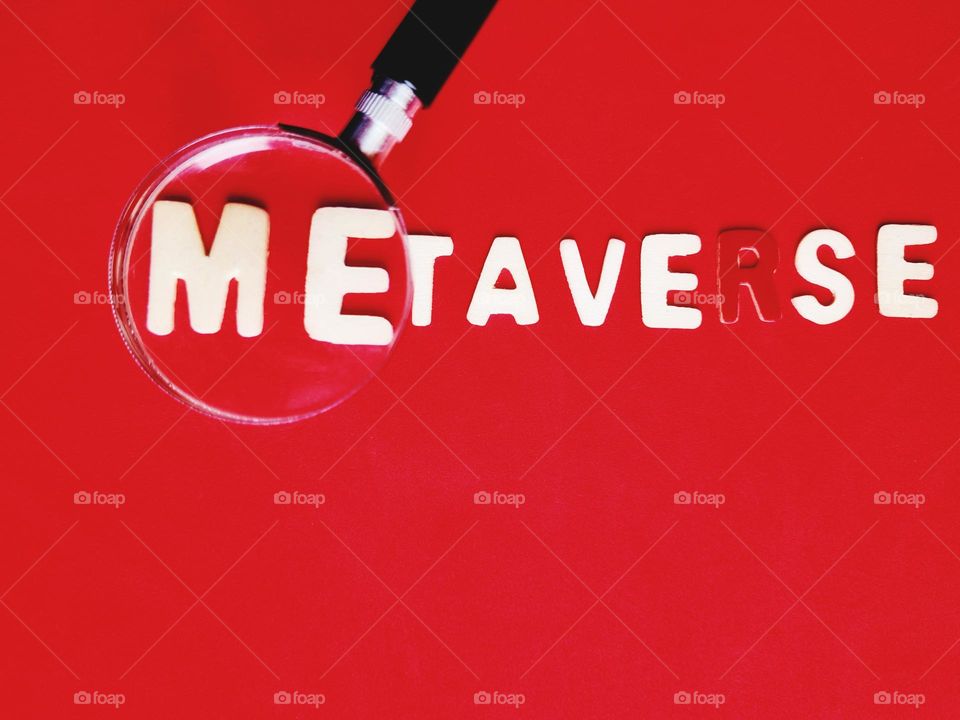 metaverse lettering on red background (virtual reality concept)