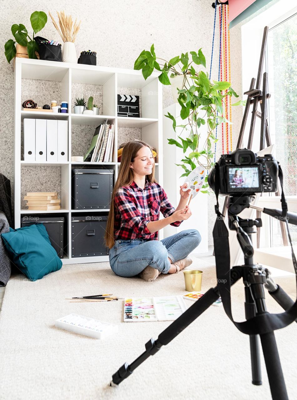 woman drawing in her apartment