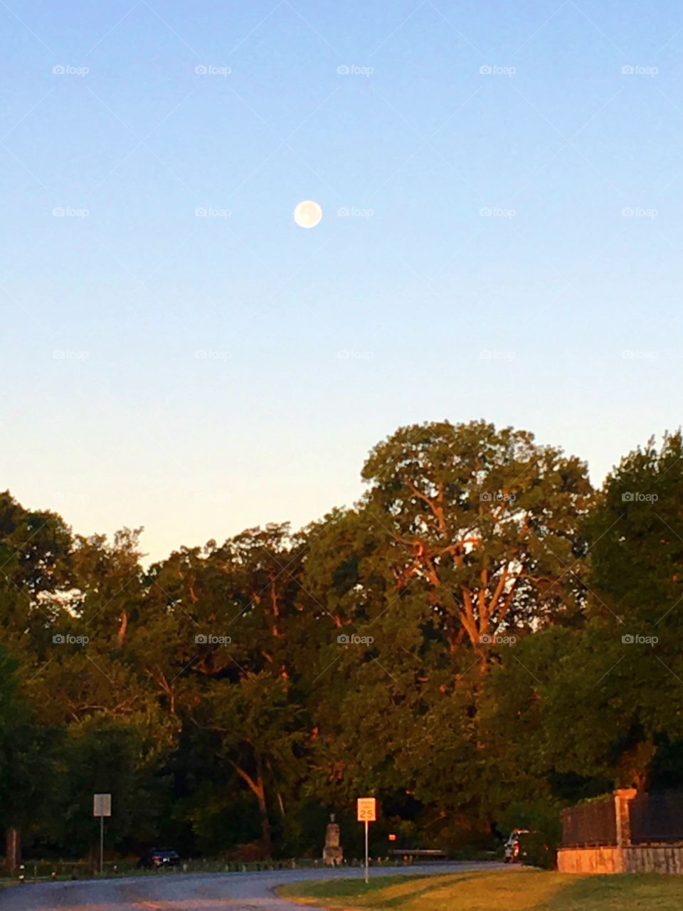 White Rock Lake . Beautiful , contemplating the beauty of the moon , on a beautiful morning 
