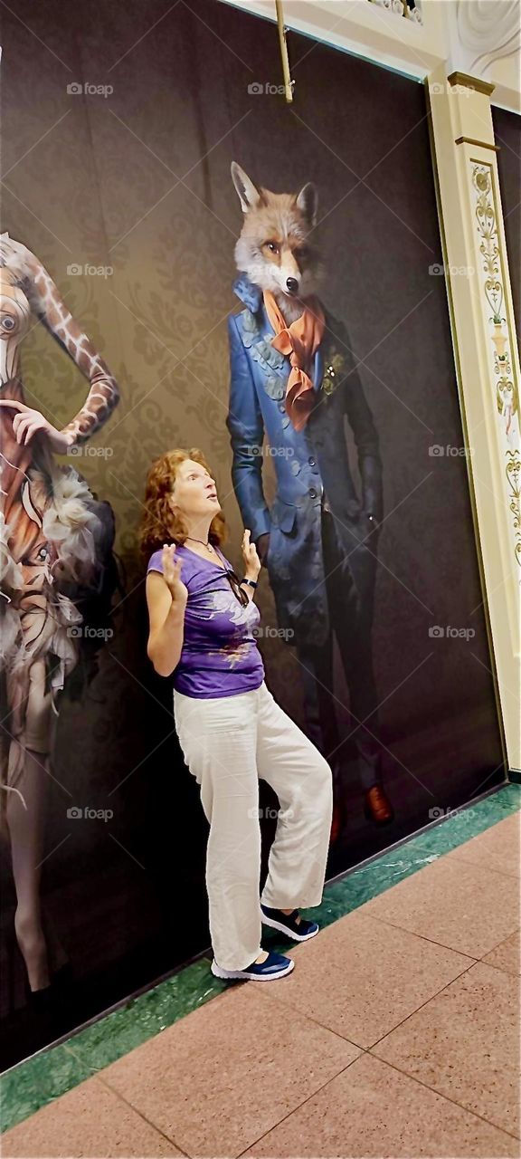 These fantasy animal models, the giraffe ballerina and the clever fox in the blue tuxedo are on display at “das Schloss”, “the Castle”, a popular multistory shopping mall in “Berlin”, Germany in the “Steglitz” district. 2024. Hypnotic Productions