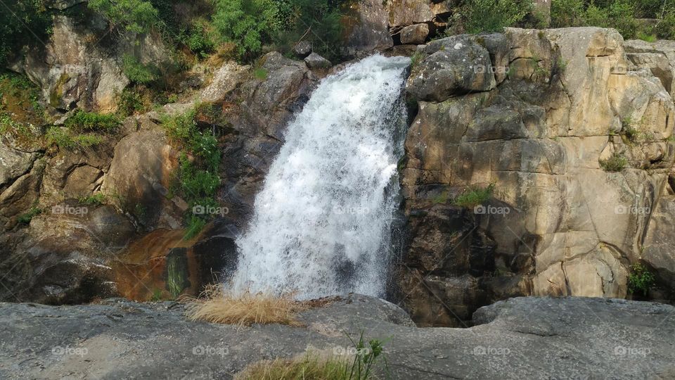 Waterfall falling into a gorge