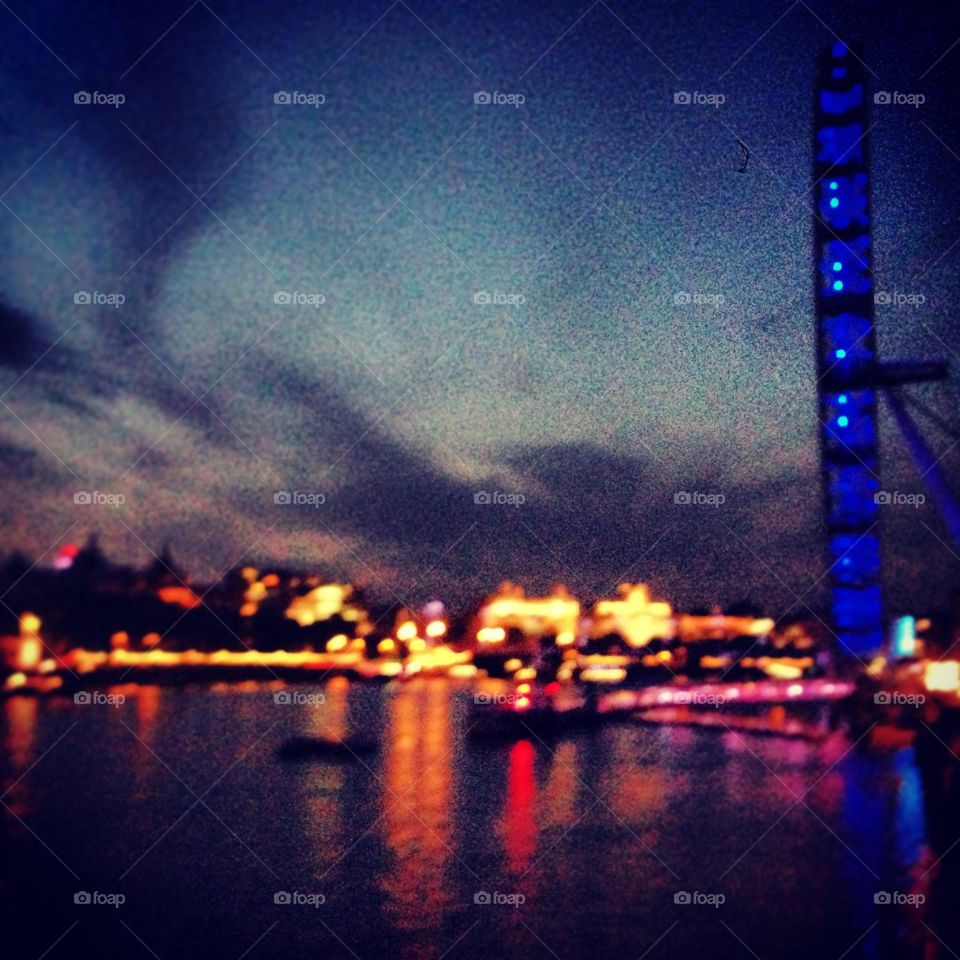 London eye by night with an amazing view of the Thames