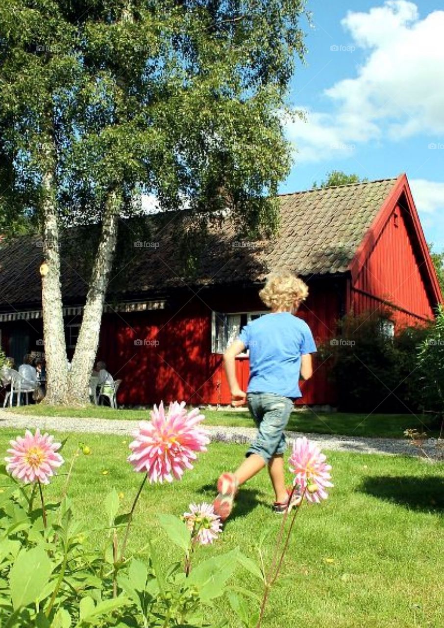 A child playing in the grass