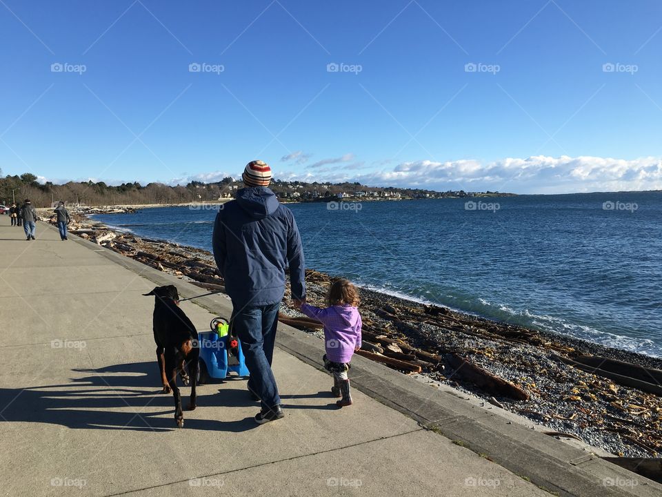 The man the dog and a little girl