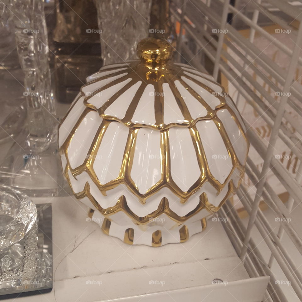 porcelain pot or a jewelry box but it's beautiful and I like the gold accent.