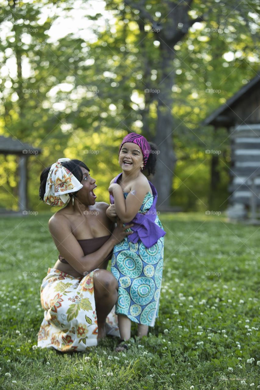 Mother making daughter laugh