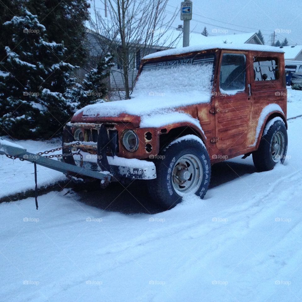 Snow on old abandoned Suzuki