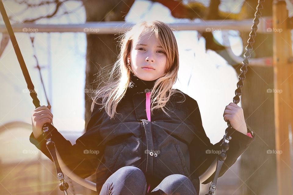 Girl swinging. A girl swinging in the park