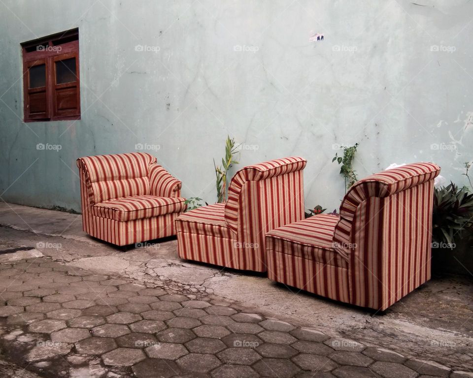 empty chairs against the wall