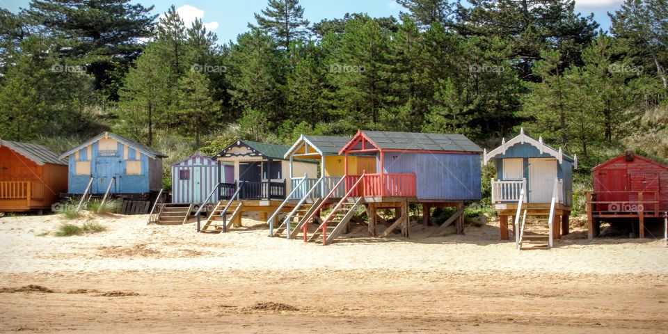 Beach Huts, Wells next the Sea on the North Norfolk Coast UK. Part on the Holkham Estate. Beautiful Sandy Beach set on a back drop of Pinewoods. 