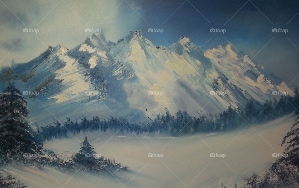 Painted mountains, snow, and cabin, evergreen trees