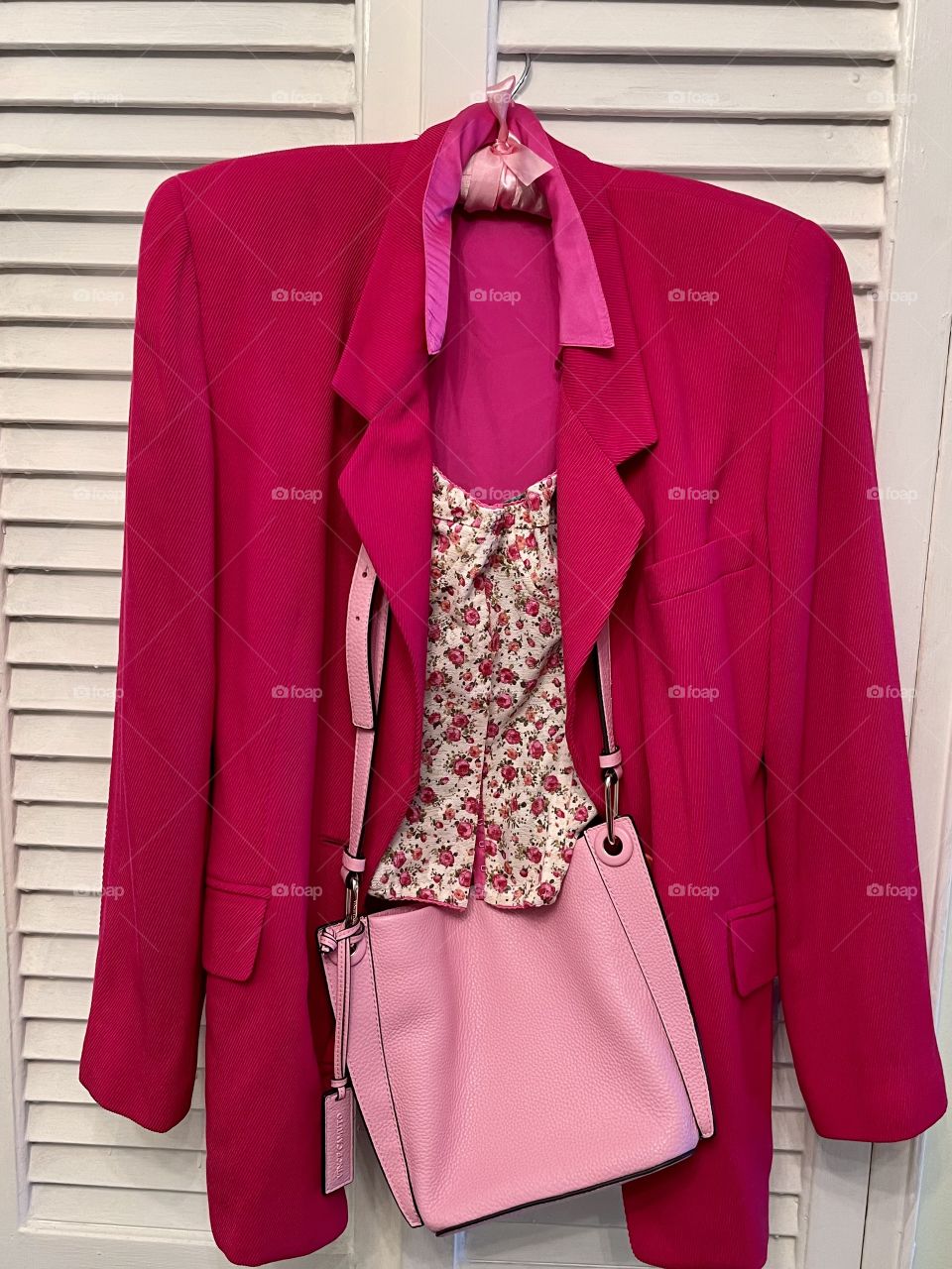 Blazer in pink with flowered cami. 