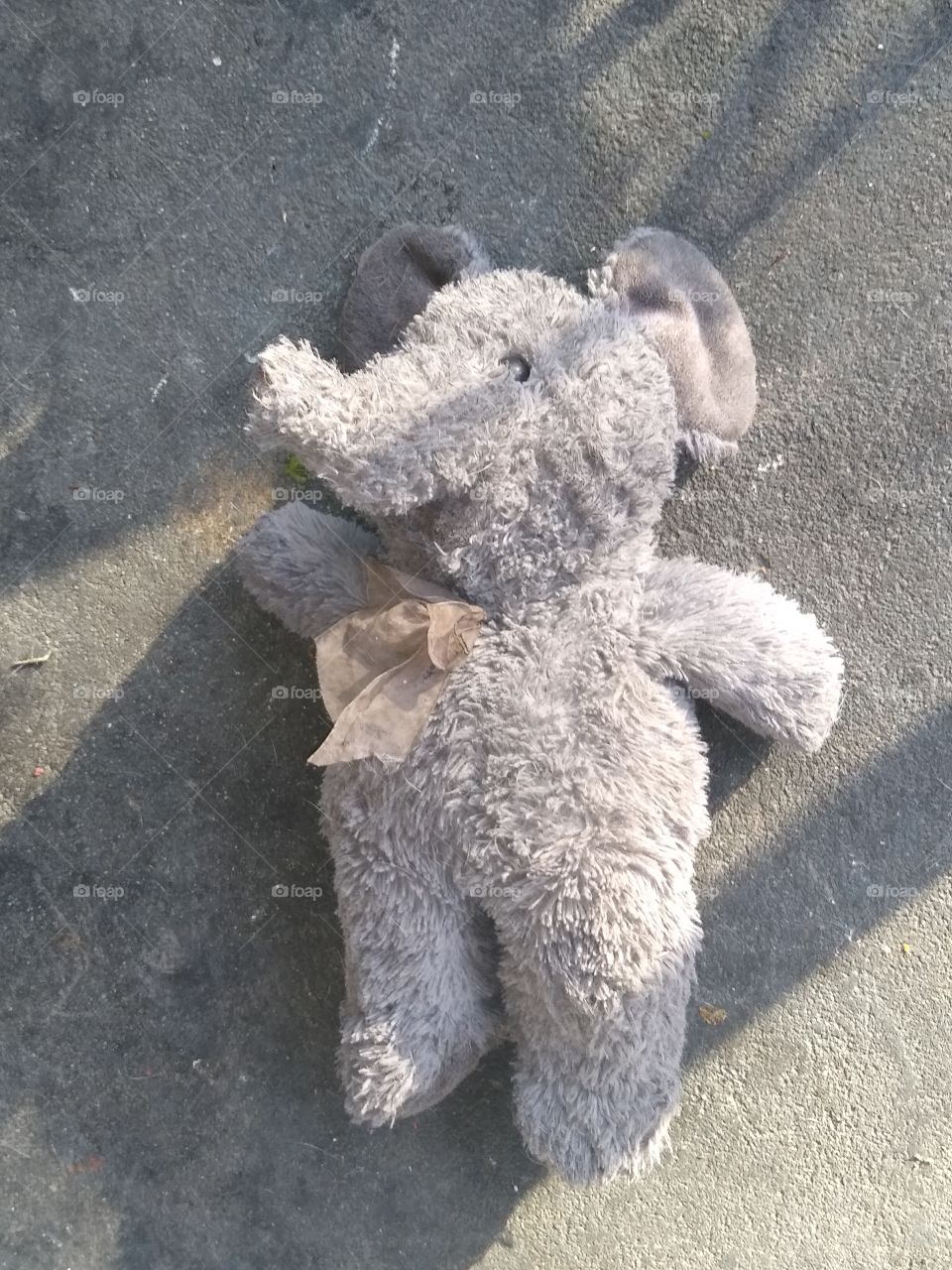 a child's stuffed elephant below poverty level