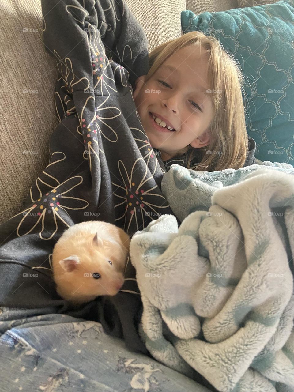 Little girl and her sweet favorite pet hamster! 