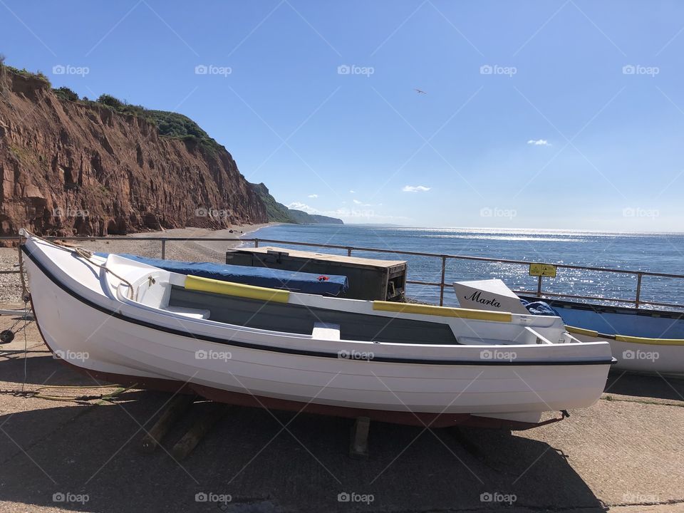 One of two photos taking in the fishing boats of Sidmouth and the landscape stretching to Beer, Devon UK