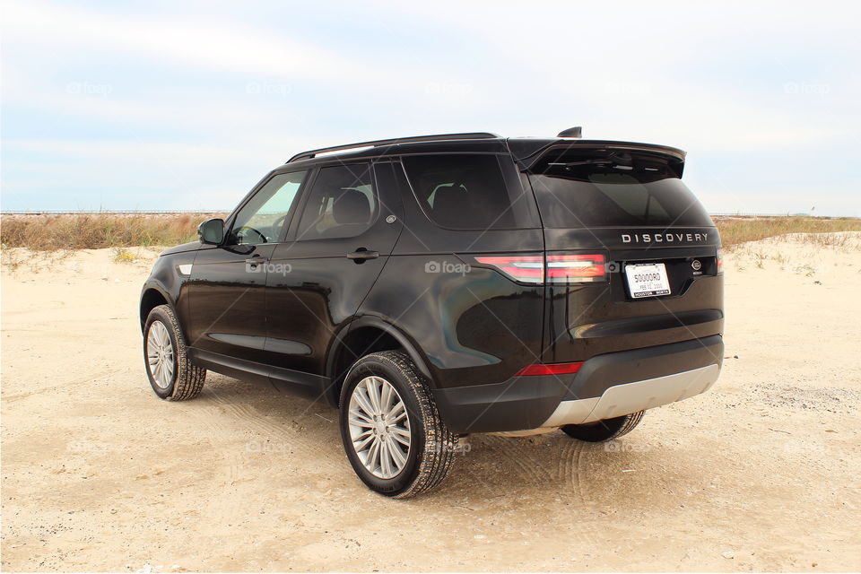 2017 land rover discovery hse on sandy beach with dunes, jetty park, matagorda, texas