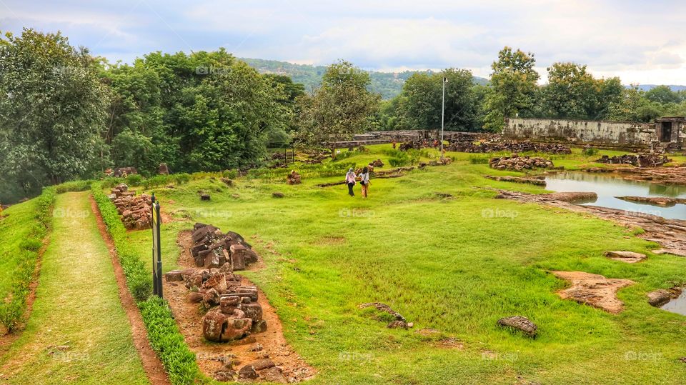 A green field inside the Ratu Boko palace compound. Ratu Boko palace is one of many ancient buildings, especially in Jogjakarta region of Indonesia