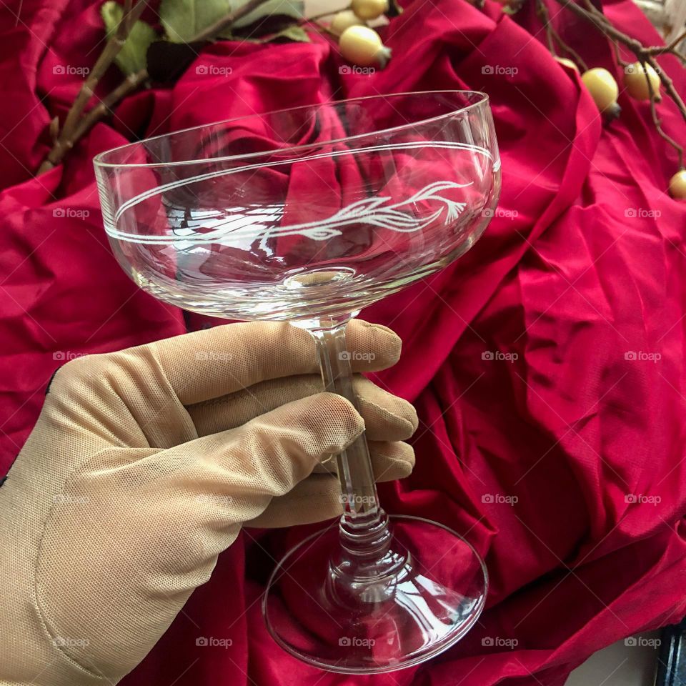 Antique crystal champagne chalet glass in hand