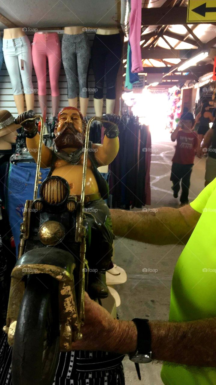 Flea Market patron showing us his treasure! Harley Davidson with biker what a fun find!